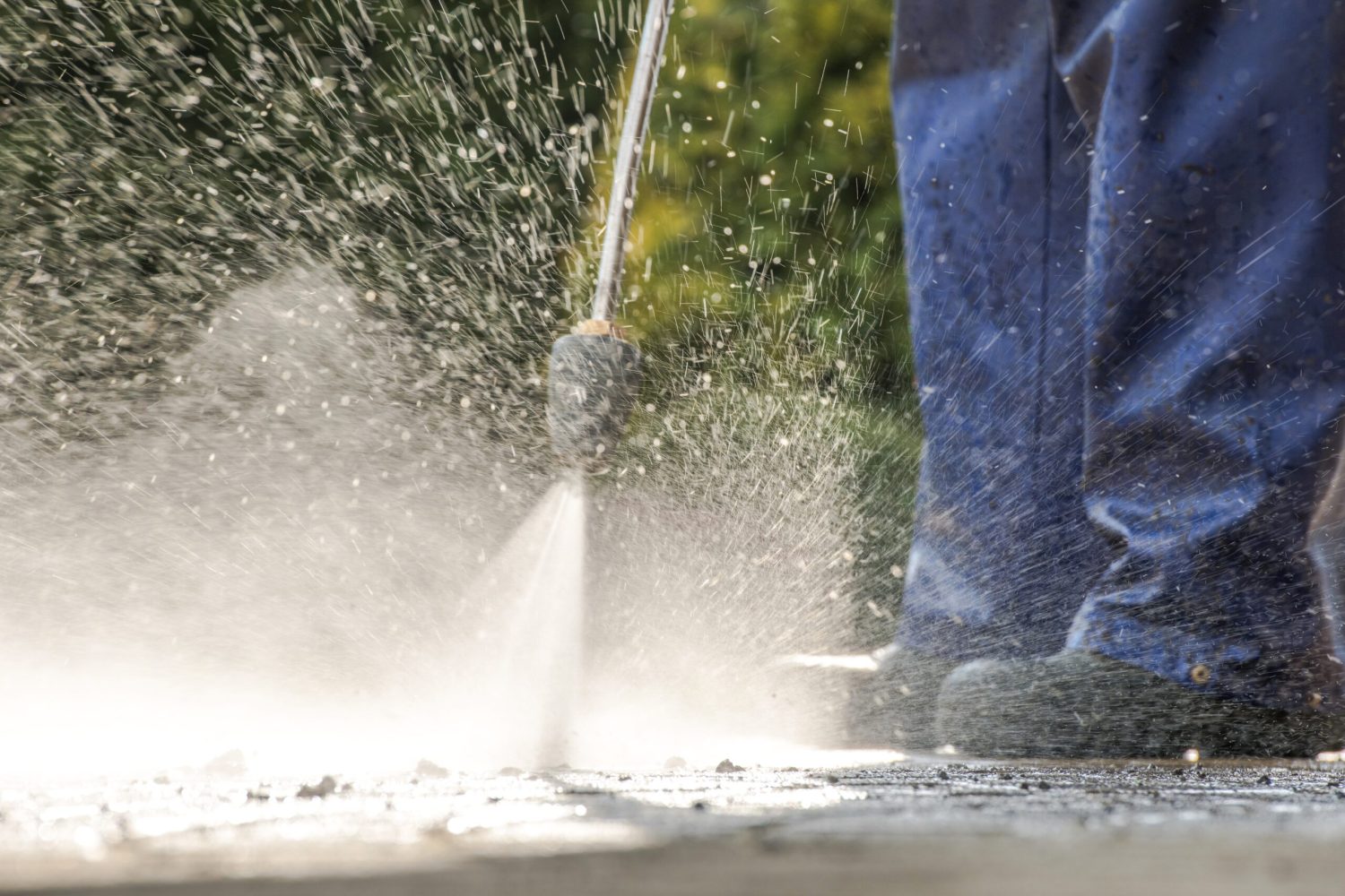 Pavement Power Cleaning. Pressure Washer in Action. Closeup Photo.