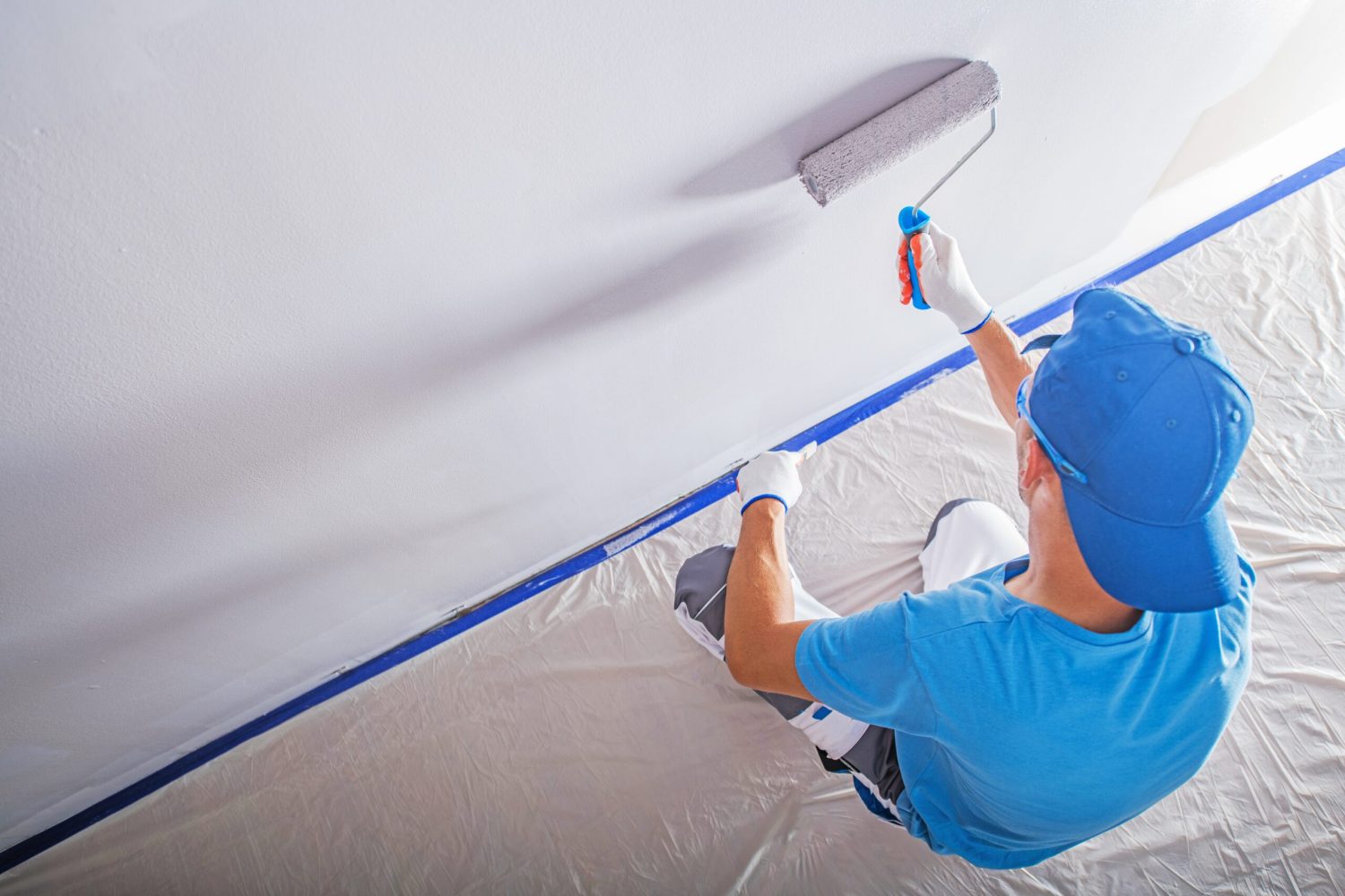 Apartment Remodeling and Painting by Caucasian Construction Worker.